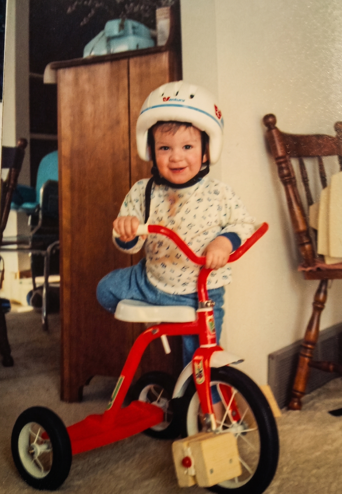Founder Matt as a child on a tricycle